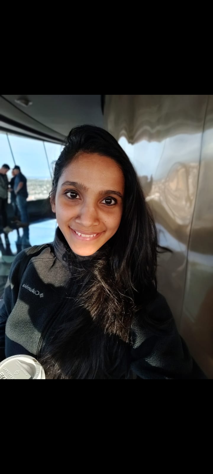Pooja Natarajan — EFT practitioner and holistic healer, hands resting on the heart